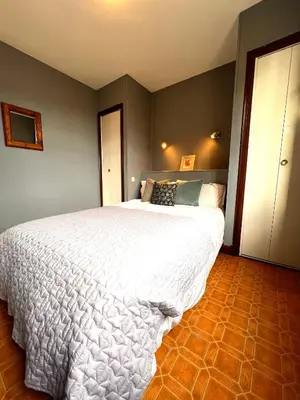 a bedroom with a large white bed in a room at Apartment with views in Limoux