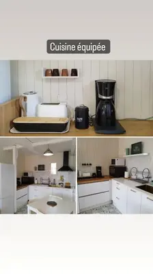 a kitchen with white cabinets and a coffee maker at Chaleureux Chalet Lac Roussinas in Anglès