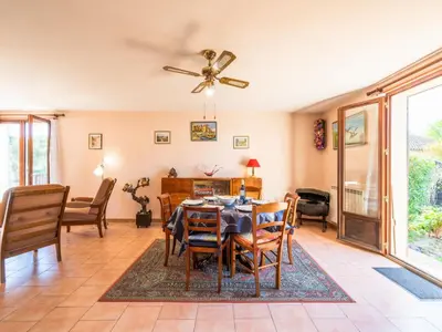 a dining room with a table and chairs at Holiday Home La maison du carignan by Interhome in Armissan