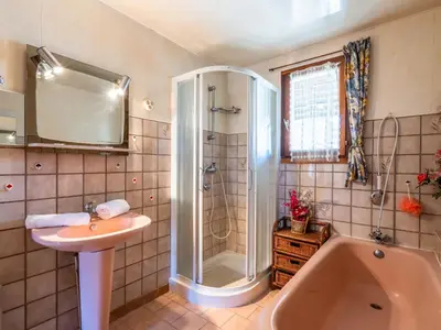 a bathroom with a shower and a sink and a tub at Holiday Home La maison du carignan by Interhome in Armissan