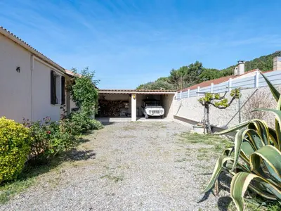 an external view of a house with a driveway at Holiday Home La maison du carignan by Interhome in Armissan