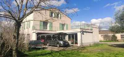 a car parked in front of a house at Chambre d'hôte chez l'habitant à la campagne in Cambounet-sur-le-Sor