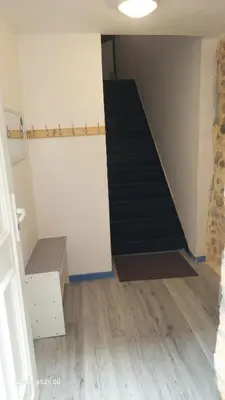 a room with a staircase and a stair case at Le duplex sigeannais in Sigean