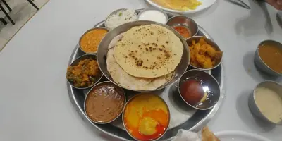 a plate with different types of food on a table at Maison avec 2 appartements, jacuzzi et accès privé à la rivière in Ladern-sur-Lauquet