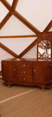 a wooden table with a vase on top of it at Les Cabanes d'ErbeFol in Ansignan
