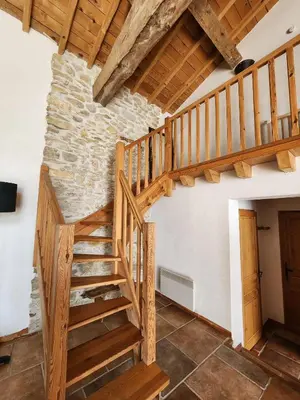 a bedroom with a bed and a desk with a fan at Le Clos Sainte Marie - Lampy in Cenne-Monestiès