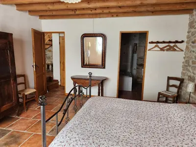 a bathroom with a toilet and a sink at Le Clos Sainte Marie - Lampy in Cenne-Monestiès