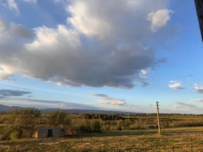 a view of a field with a cloudy sky at Jiovanni in Rieux-Minervois