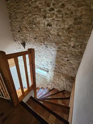 an old brick wall and stairs in a house at Le Clos sainte Marie - Crouzette in Cenne-Monestiès
