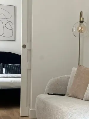 a glass table and a chair and a mirror at Situation exceptionnelle HARMONY III in Carcassonne