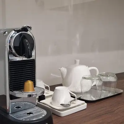a toaster and tea set on a wooden table at Situation exceptionnelle HARMONY III in Carcassonne