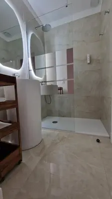 a bathroom with a shower with a glass door at Situation exceptionnelle HARMONY III in Carcassonne
