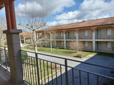 a view of a building from a balcony at Les Murmures du Lac in Azille