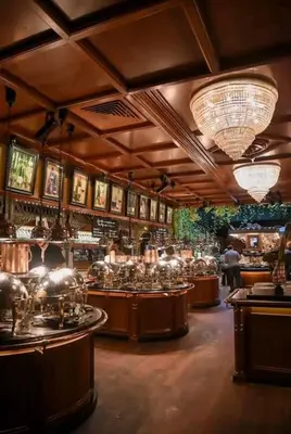 a large room with a bar with a lot of glasses at Escapade cœur de ville Narbonne in Narbonne
