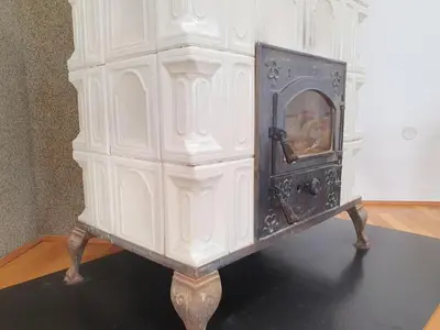 an old stove sitting on a table in a room at Le Ranch in Oupia