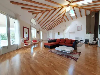 a living room with a couch and a table at Le Ranch in Oupia