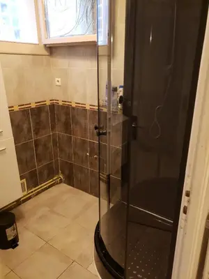a shower with a glass door in a bathroom at Maison meublée avec garage in Pamiers