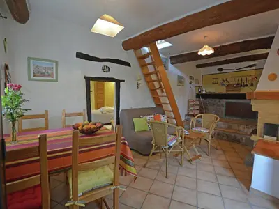 a kitchen and living room with a table and chairs at Villa in Pyrenees with Stunning Mountain Views in Fenouillet