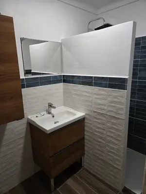 a bathroom with a sink and a mirror at Les sables d'or in Port-la-Nouvelle