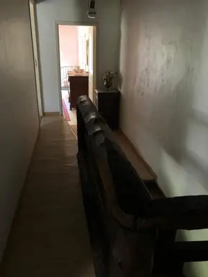 a hallway with a bench in a room at Maison de campagne Les loirs in Lespinassière