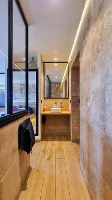 a bathroom with a sink and a large window at Le Relais de Diligence Balnéo & Sauna in Salsigne