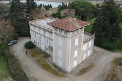 an aerial view of a large building with a car in front at Demeure Familiale du 19ème Siècle in Bram