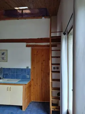 a kitchen with a bunk bed in a room at Bright loft with mountain and nature view in Sougraigne