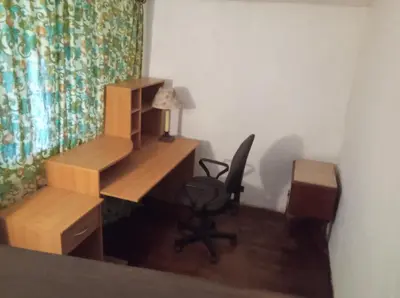 a room with a desk and a chair and a desk and a chair at Maison de village avec jardin in Saint-Louis-et-Parahou