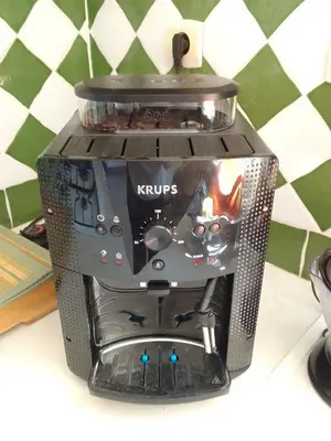 a coffee maker sitting on top of a table at Gite de l'Etang proche des Grands Buffets in Narbonne