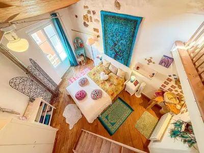 an overhead view of a living room with a table at Petite Maison de Resource avec Cuisine in Rennes-les-Bains