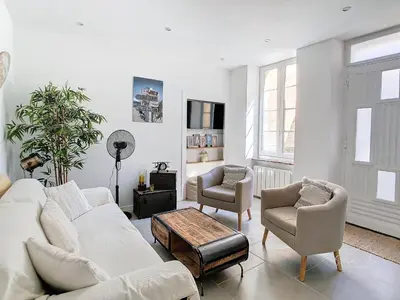 a living room with a couch and two chairs and a table at Le chant des vignes - Maison pour 6 avec patio in Aigne