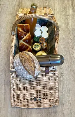 a picnic basket with bread and butter and condiments at Parenthèse en Forêt - Gîte Hautbois, Sidobre in Le Bez