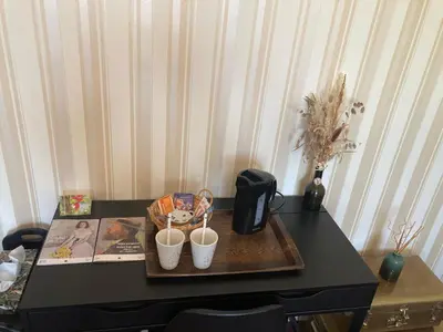 a black table with two cups on top of it at Chambre au calme in Lagarrigue