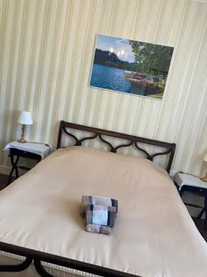 a bed with a pillow on it in a bedroom at Chambre au calme in Lagarrigue