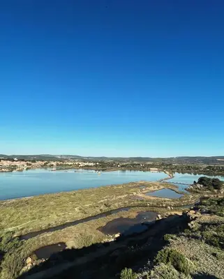 an aerial view of a river with a blue sky at Appartement 1 chambre in Peyriac-de-Mer