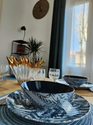 a table with a bowl on top of a table at Will's Appart in Narbonne