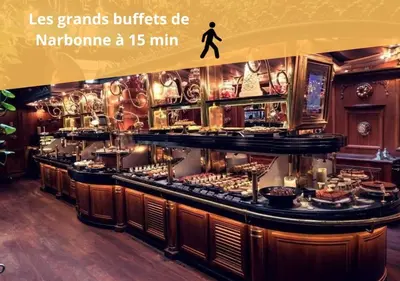 a restaurant with a counter with food on it at L'Orchidée, proche de la gare avec clim et terrasse in Narbonne