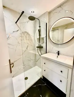 a bathroom with a shower and a mirror at Pierre Lauragaise in Avignonet-de-Lauragais