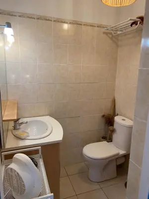 a bathroom with a toilet and a sink at Casa Bohème in Saint-Jean-de-Barrou