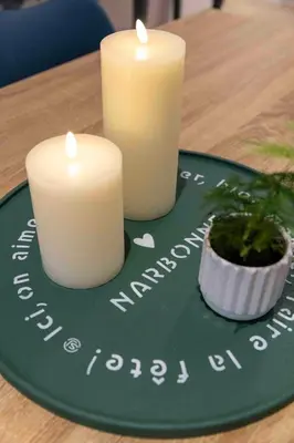 two candles on a green plate with a candleiversary sign at Olivier ATTON in Narbonne