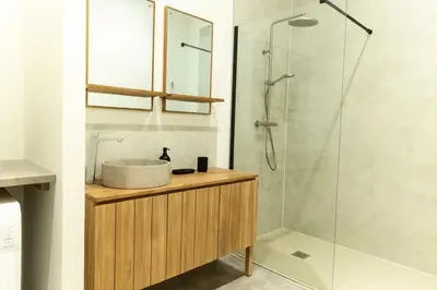 a bathroom with a sink and a shower at Olivier ATTON in Narbonne