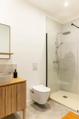 a bathroom with a shower and a toilet and a sink at Olivier ATTON in Narbonne