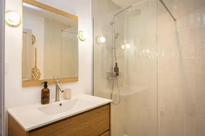 a bathroom with a sink and a shower at Carcassonne Epicerie in Carcassonne