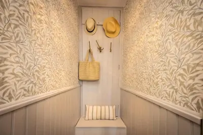 a hallway with straw hats on the wall at Carcassonne Epicerie in Carcassonne