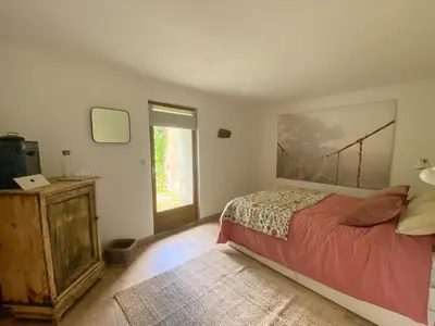 a bedroom with a bed and a window at Villa Kiener in Villeneuve-la-Comptal