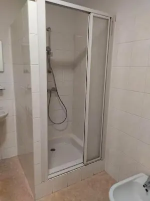 a bathroom with a shower and a sink at Charmante maison de village cessenon sur Orb in Cessenon