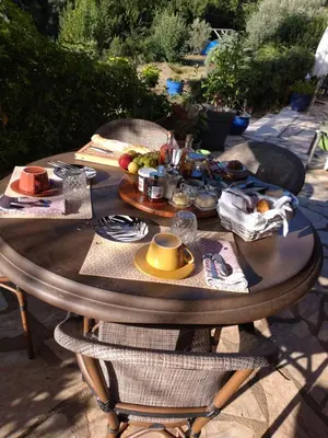 a wooden table with food on top of it at Occit'Homières in Saint-Pons