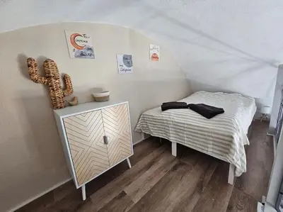 a bedroom with a bed and a dresser in a tent at Joli & Cosy ! 4 Personnes in Gruissan