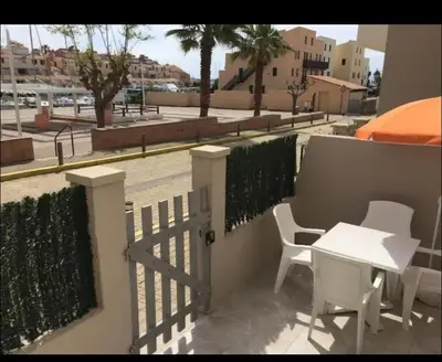 a balcony with a table and chairs and a fence at Appartement port GRUISSAN in Gruissan