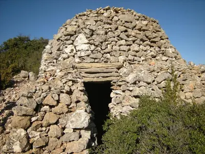 an old stone building with a hole in it at 